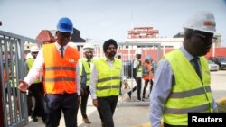 FILE: Unopposed nominee to head World Bank Ajay Banga walks with officials during his visit at the headquarters of Ivorian electricity company of Yopougon in Abidjan, Ivory Coast, March 7, 2023.