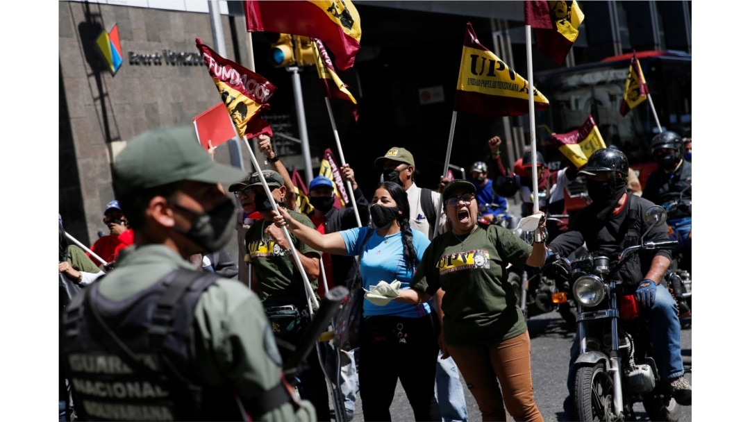 Members of Venezuelan People's Union (UPV) protest outside Venezuela's National Assembly building during the swear-in ceremony for a new term in Caracas, Venezuela, Jan. 5, 2021.