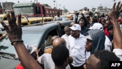 Martin Fayulu elongo na Adolphe Muzito (az'o monana te) kati na balandi ba bango na botamboli na Kinshasa, 30 juin 2019.