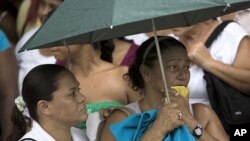 Inmates' relatives wait for news outside Rodeo I prison after a riot at the prison in Guatire on the outskirts of Caracas, Venezuela, June 13, 2011