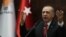 Turkey's president and leader of Turkey's Justice and Development (AK) Party, Recep Tayyip Erdogan, delivers a speech during his party's parliamentary group meeting at the Grand National Assembly of Turkey, in Ankara, Feb. 5, 2019.