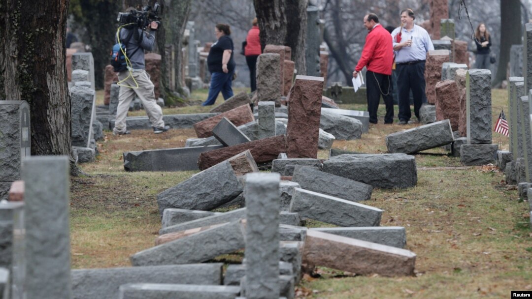 Local and national media report on more than 170 toppled Jewish headstones after a weekend vandalism attack on Chesed Shel Emeth Cemetery in University City, a suburb of St Louis, Missouri, Feb. 21, 2017. 