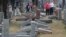 FILE - Local and national media report on more than 170 toppled Jewish headstones after a weekend vandalism attack on Chesed Shel Emeth Cemetery in University City, a suburb of St Louis, Missouri, Feb. 21, 2017. 