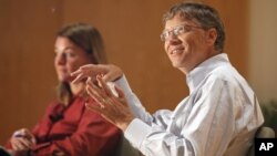 Bill Gates, accompanied by his wife Melinda speak to students at an appearance at Central Piedmont Community College in Charlotte, North Carolina. 