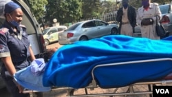 Johanna Mamombe in a stretcher outside a Harare Hospital. (VOA)