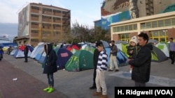 Thousands of refugees are living in tents and converted warehouses at Piraeus port, Athens in Greece, March 17, 2016.