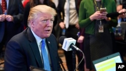 President Donald Trump sits for a radio interview in the Eisenhower Executive Office Building in the White House complex in Washington, Oct. 17, 2017. 