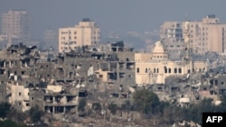 FILE - This picture taken from Israel's southern city of Sderot shows damaged buildings in the northern Gaza Strip on October 22, 2023, amid ongoing battles between Israel and the Palestinian group Hamas.