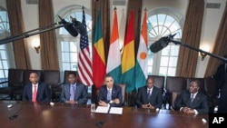 President Barack Obama meets with, from left, Niger President Mahamadou Issoufou, Benin President Boni Yayi, Guinea President Alpha Conde, and Cote d'Ivoire President Alassane Ouattara, in the Cabinet Room of the White House in Washington, DC, July 29, 20