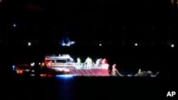 Rescue boats work the scene on the Potomac River near Ronald Reagan Washington National Airport, Jan. 29, 2025, in Arlington, Va.