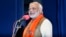Hindu nationalist Narendra Modi, who will be the next prime minister of India, addresses Gujarat state lawmakers and party workers during the appointment of the state's new chief minister in Gandhinagar, May 21, 2014.