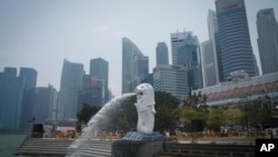 FILE - Merlion statue with the background of business district in Singapore, Saturday, Sept, 21, 2019. Singaporean man, Abdul Kahar Othman, 68, on death row for drug trafficking was hanged Wednesday, March 30, 2022, in the first execution in the city-stat