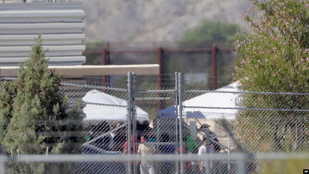Detainees are seen at a facility where tent shelters are being used to house separated family members at the Port of Entry in Fabens, Texas, June 21, 2018.