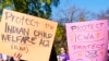 Demonstrators stand outside the U.S. Supreme Court in Washington, Nov. 9, 2022, as the court hears arguments over the Indian Child Welfare Act. AP Photo/Mariam Zuhaib.