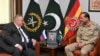 In this photo released by Inter Services Public Relations, Russian Deputy Prime Minister Alexei Overchuk, left, meets with Pakistan's Army Chief Gen. Asim Munir, in Rawalpindi, Pakistan, Sept. 18, 2024. 