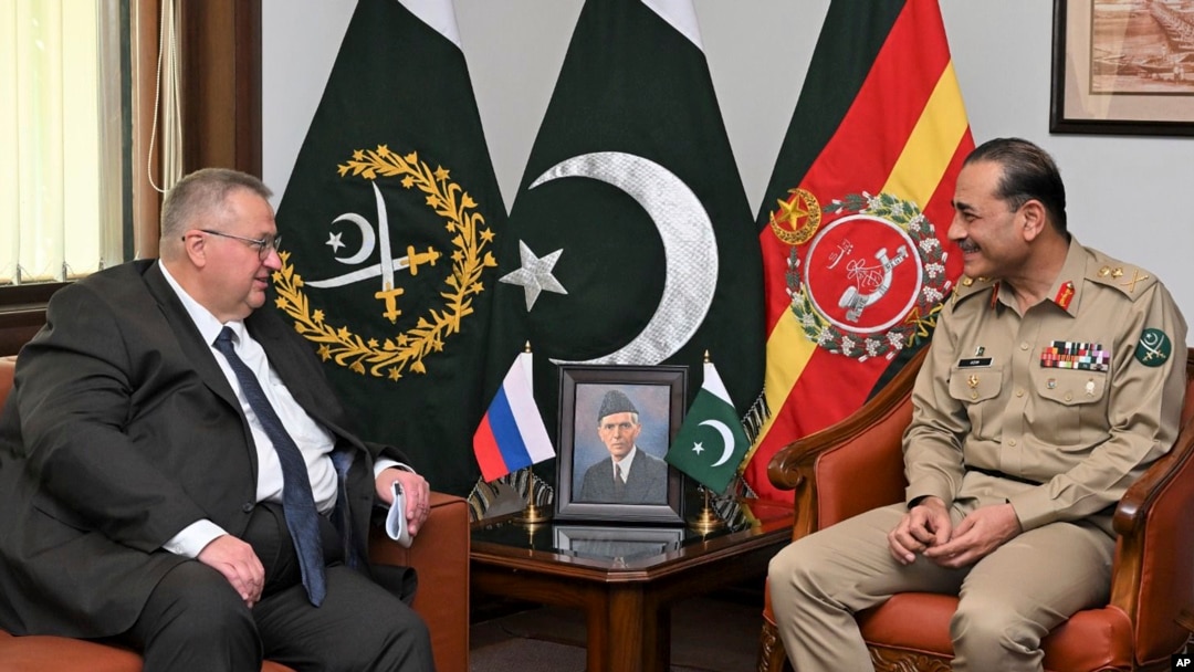In this photo released by Inter Services Public Relations, Russian Deputy Prime Minister Alexei Overchuk, left, meets with Pakistan's Army Chief Gen. Asim Munir, in Rawalpindi, Pakistan, Sept. 18, 2024. 