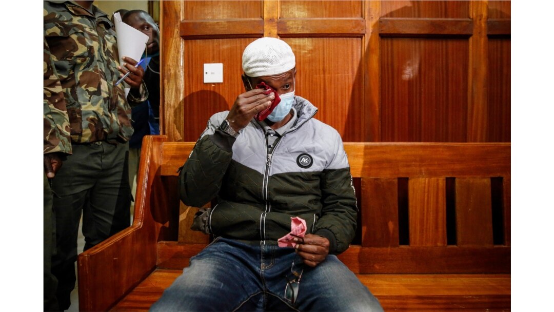 Liban Abdullah Omar, who was found innocent of supporting the gunmen involved in the Westgate Mall attack in Sept. 2013, reacts after the verdict is delivered at Milimani court in Nairobi, Kenya, Oct. 7, 2020.