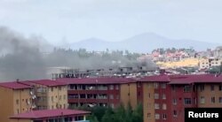 Smoke rises over Addis Ababa during protests following the fatal shooting of the Ethiopian musician Hachalu Hundessa, June 30, 2020, in this screengrab taken from a video.