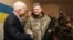 Ukrainian President Petro Poroshenko (R) shakes hands with U.S. Senator John McCain during a meeting with Ukrainian servicemen in Shirokino settlement near Mariupol, Ukraine, Dec. 31, 2016.