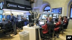 Traders at Meridian Equity Partners work on the floor of the New York Stock Exchange in New York, September 6, 2011.
