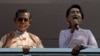 FILE - In this Nov. 9, 2015, photo, Myanmar's pro-democracy icon Aung San Suu Kyi, right, delivers a speech as close ally Tin Oo waves in Yangon, Myanmar. Tin Oo died June 1, 2024, at the age of 97.