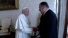 U.S. Secretary of State Mike Pompeo shakes hands with Pope Francis on the sidelines of a symposium at the Vatican, October 3, 2019 in this still image taken from a video.