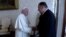 U.S. Secretary of State Mike Pompeo shakes hands with Pope Francis on the sidelines of a symposium at the Vatican, October 3, 2019 in this still image taken from a video.