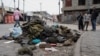 People look at military uniforms and equipment abandoned in the streets of Goma amid conflict between M23 rebels and the Congolese army in Goma, Democratic Republic of the Congo, on Jan. 29, 2025.