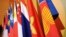The Association of the Southeast Asian Nations (ASEAN) flag, right, leads the flags of the 10 member countries during the ASEAN Regional Forum meeting.