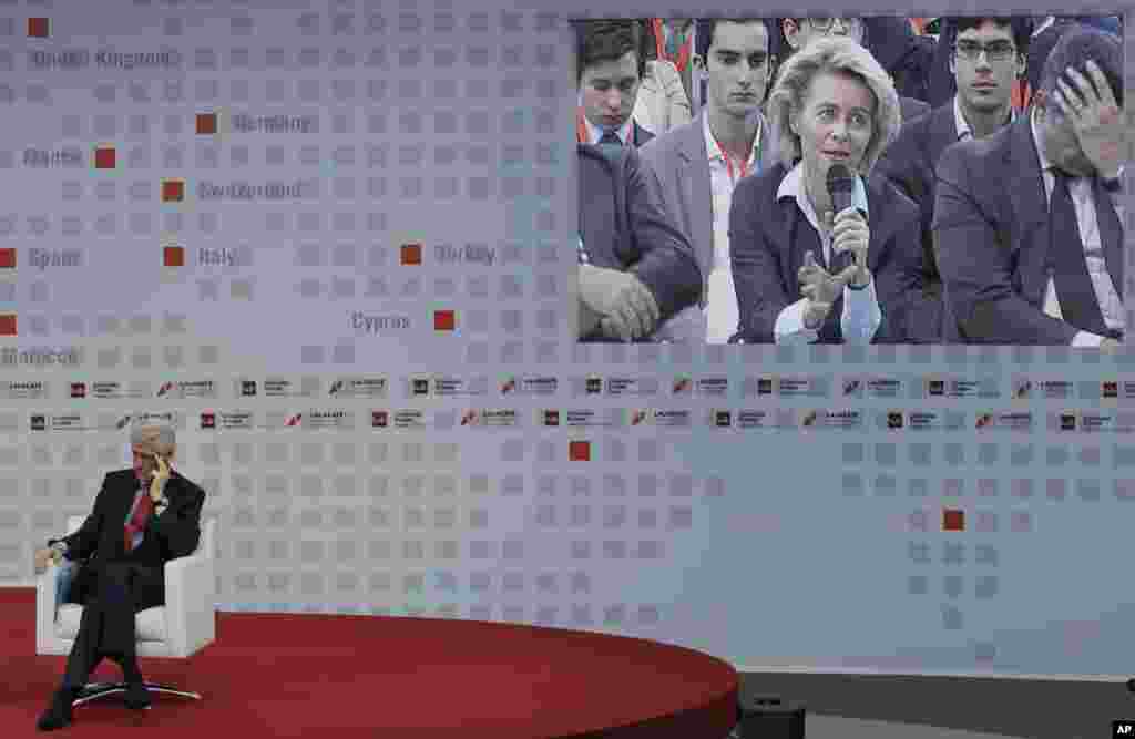 Former U.S. President and Honorary Chancellor of Laureate International Universities Bill Clinton listens to the German Federal Minister for Labor and Social Affairs Ursula von der Leyen, second right, during a forum to address the youth unemployment situation in Europe at the European University of Madrid, in Madrid, Spain.