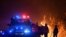 NSW Rural Fire Service crews protect properties on Waratah Road and Kelyknack Road as the Three Mile fire approaches Mangrove Mountain, Australia, Dec. 5, 2019.