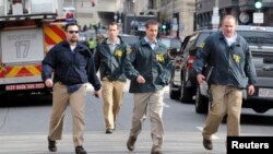 Karmendên FBI li bajarê Boston.