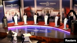 The eight Kenyan presidential aspirants Mohammed Dida, James Ole Kiyiapi, Uhuru Kenyatta, Peter Kenneth, Musalia Mudavadi, Martha Karua, Kenyan Prime Minister Raila Odinga and Paul Muite (L-R) face off in a presidential debate in Nairobi, February 11, 201