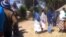 Voters captured recently waiting to cast their ballots in the Zimbabwe general election won by President Robert Mugabe's Zanu PF