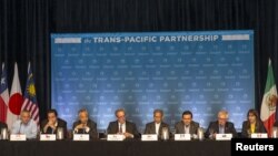 The 12 Trans-Pacific Partnership (TPP) Ministers hold a press conference to discuss progress in the negotiations in Lahaina, Maui, Hawaii, July 31, 2015. 