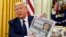 FILE - President Donald Trump holds up a copy of the New York Post as he speaks before signing an executive order aimed at curbing protections for social media giants, in the Oval Office of the White House, May 28, 2020.