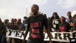 Protesters opposed to President Abdoulaye Wade running for a third term shout slogans during a rally in Dakar, Senegal, January 31, 2012.