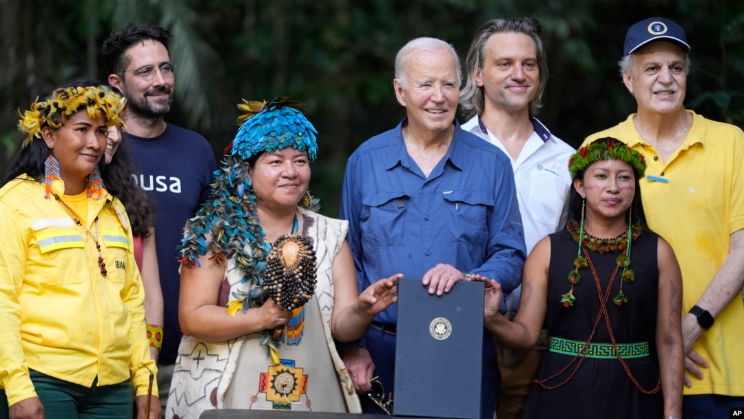 President Joe Biden poses for a photo after signing a proclamation designating Nov. 17 as International Conservation Day, following a tour of the Museu da Amazonia, in Manaus, Brazil, Nov. 17, 2024.