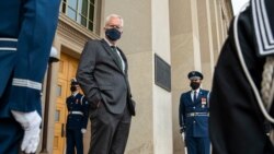 FILE - Acting U.S. Secretary of Defense Christopher Miller stands on the steps of the Pentagon entrance in Arlington, Virginia, Nov. 13, 2020.