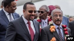 Le Premier ministre éthiopien Abiy Ahmed et le ministre érythréenne des Affaires Etrangères, Osman Saleh Mohammed.