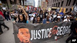 People march for the one-year anniversary of George Floyd's death, in Minneapolis, Minnesota, May 23, 2021. 
