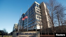 Flags fly at half-staff outside of the office of UnitedHealthcare, the day after the CEO of UnitedHealthcare, Brian Thompson was shot dead, in Minnetonka, Minnesota, Dec. 5, 2024.