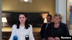 Belarusian opposition leader Sviatlana Tsikhanouskaya, left, and Norwegian Prime Minister Erna Solberg attend a news conference in Vilnius, Lithuania, Sept. 8, 2020.