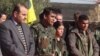 Şervanên YPG li Kobanê di nav avahîyên wêran xuya dibin