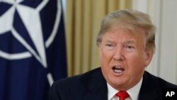 U.S. President Donald Trump speaks during a meeting with NATO Secretary General, Jens Stoltenberg at Winfield House in London, Tuesday, Dec. 3, 2019. 