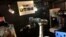 A robot bartender moves its arm to make a cocktail at a Japanese pub operated by restaurant chain Yoronotaki in Tokyo, Jan. 29, 2020. 