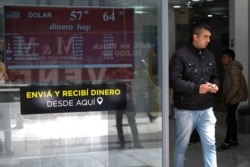 A man walks out from a currency exchange shop in Buenos Aires, Argentina, Oct. 29, 2019.