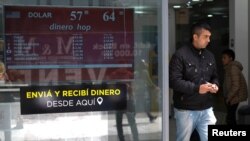 A man walks out from a currency exchange shop in Buenos Aires, Argentina, Oct. 29, 2019. 