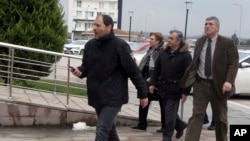 Parents of the arrested Greek soldiers, at center, arrive at the courthouse in Edirne, Turkey, March 5, 2018. 