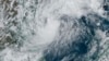 This GOES-16 GeoColor satellite image taken at 4:50 p.m. EDT and provided by National Oceanic and Atmospheric Administration (NOAA) shows Tropical Storm Milton, center, off the coast of Mexico in the Gulf of Mexico, Oct. 5, 2024.